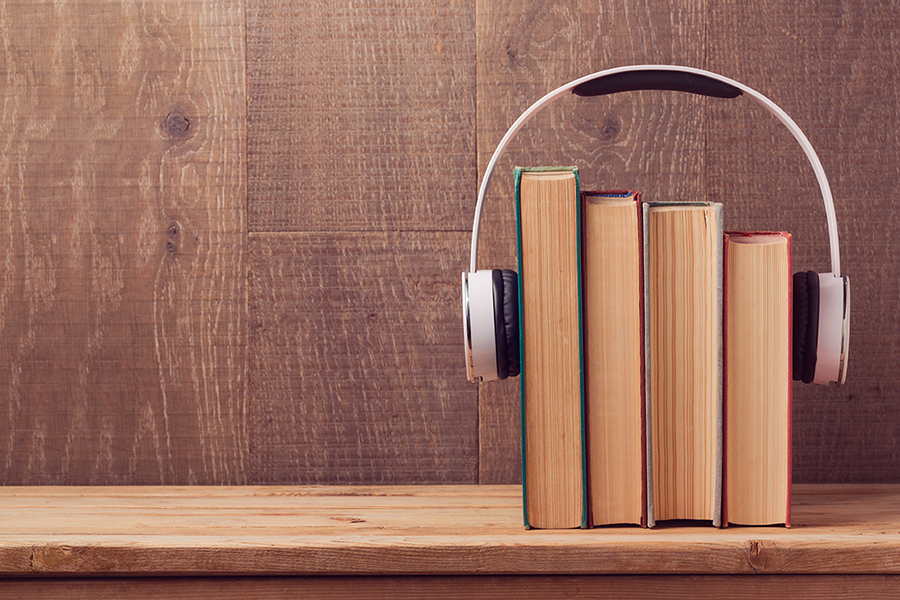 books with headphones on